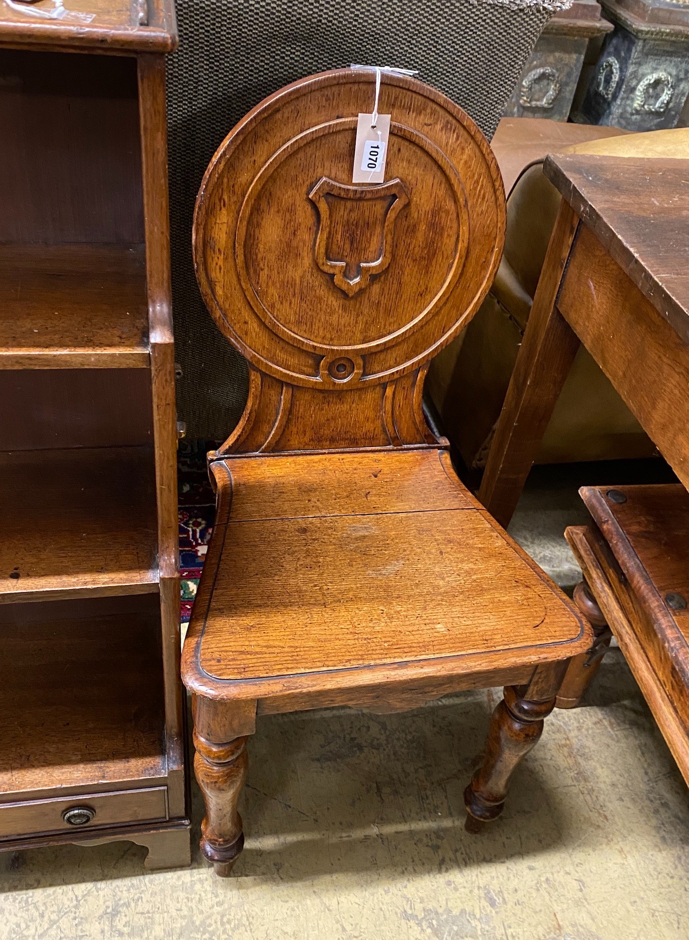 A Victorian oak hall chair